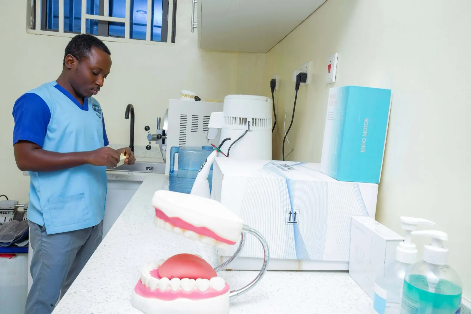 A Zenith clinician preparing denture and restorative work at the clinic bench