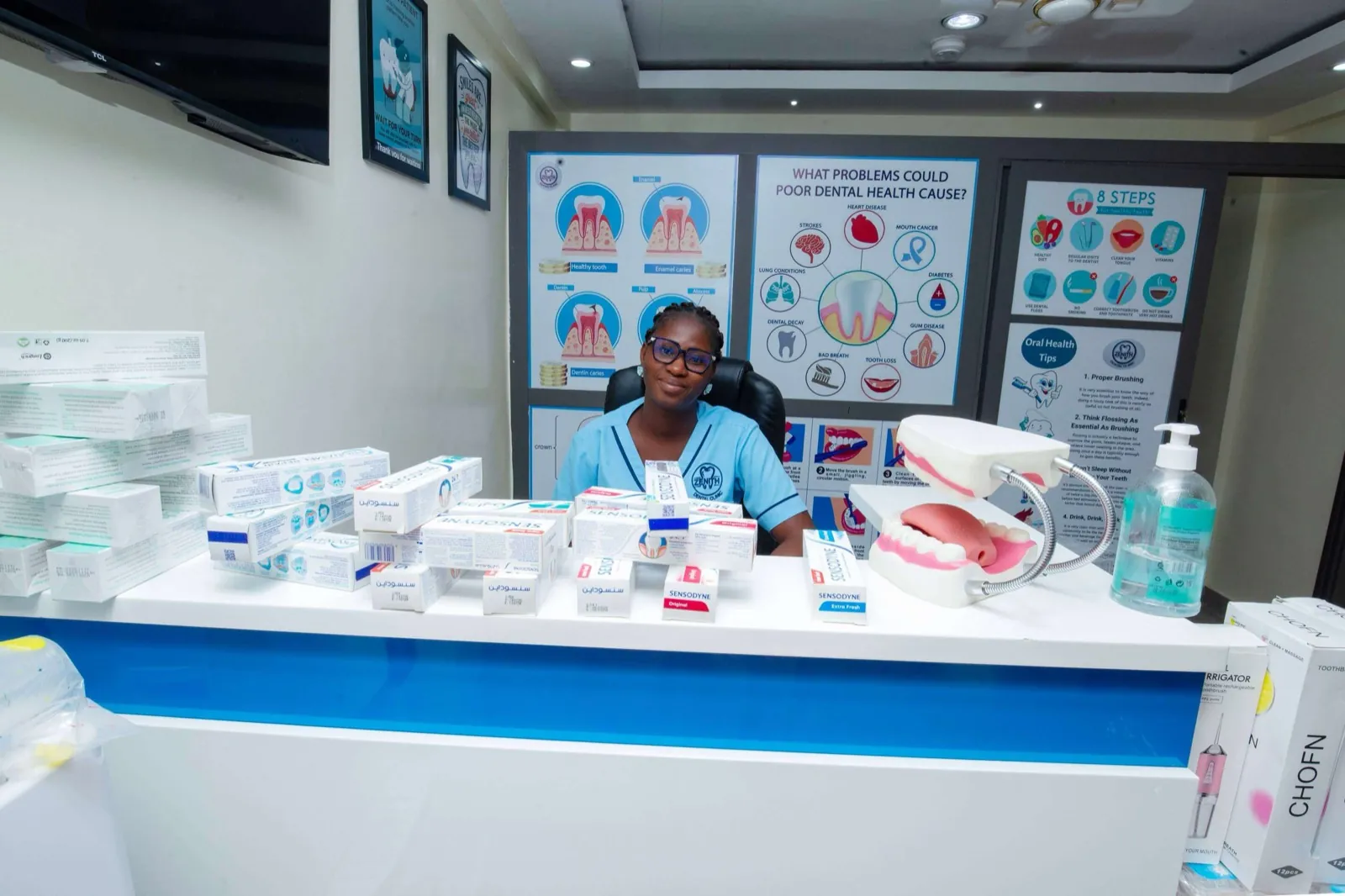 The branded Zenith Dental Clinic reception, with our welcome desk and oral-health information wall